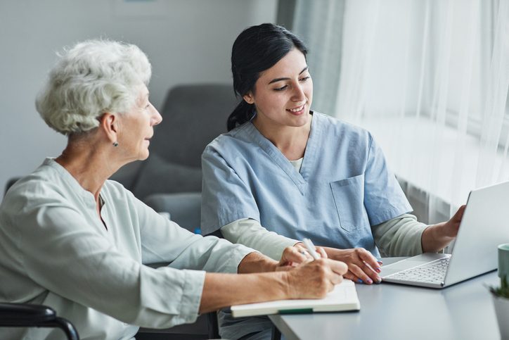 A healthcare professional reviewing care options with an older woman