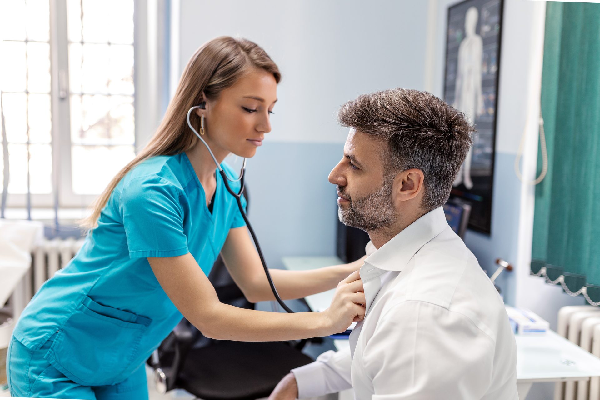 A healthcare professional examining a patient with a stethoscope